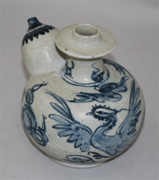 An Annamese blue and white porcelain kendi, 15th century, 15.5cm, sea-etched glaze